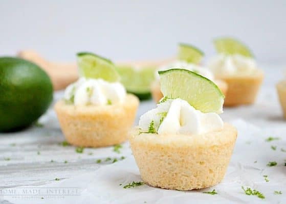 Lime cookie cups. Sugar cookie cups filled with lime cheesecake and topped with whipped cream.