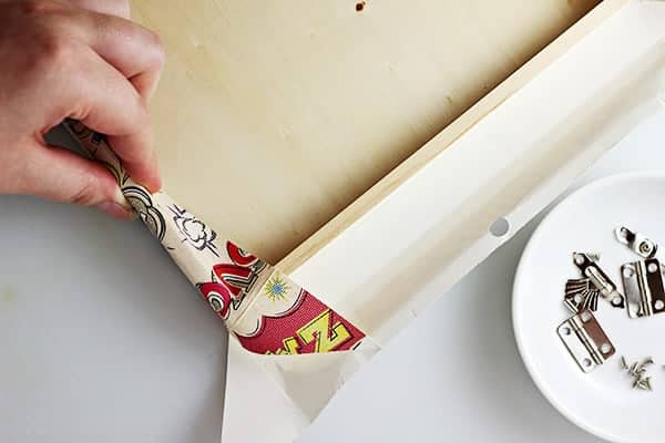 Cover a box in scrapbook paper to make a totally custom look for pennies!