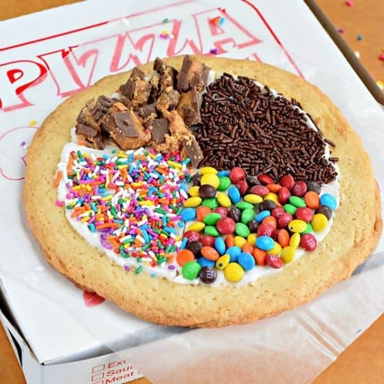 Dessert pizzas are candy and frosting on a sugar cookie. A fun summer activity to do with the kids.