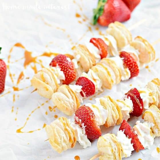 Light and airy puff pastry layered on top of fresh strawberries and whipped cream. These strawberry shortcake kabobs are a light dessert for summer parties.