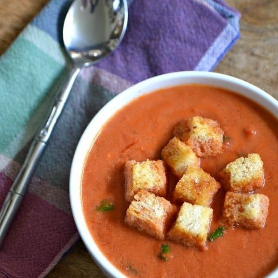 This Creamy Tomato Soup with Garlic Croutons is the perfect cold weather comfort food ... plus, it's easy to make! | Hello Little Home for The Pinning Mama
