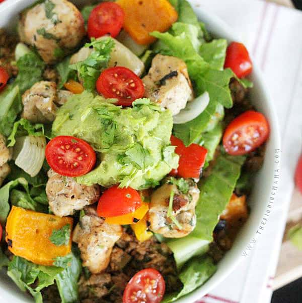 Get your burrito fix while eating Paleo with this crazy good Fajita Burrito Bowl made with mexican cauliflower rice. Gluten Free, dairy free, whole30 compliant recipe.