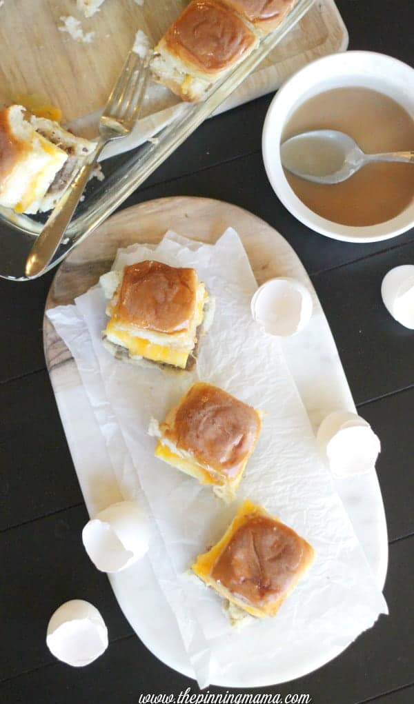 Easy breakfast or brunch for a crowd. Sausage egg and cheese breakfast sliders with syrup glaze. A sweet and salty treat!