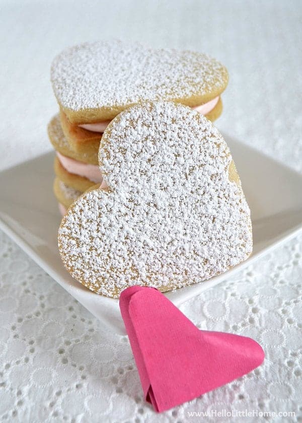 These Heart Sandwich Cookies with White Chocolate Cream Cheese Filling are an irresistible Valentine's Day treat! | Hello Little Home