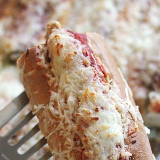 Chicken Parmesan Sub Bake - GENIUS! Make a whole pan of chicken parm sandwiches in minutes! Only 4 ingredients and perfect for a party or potluck!