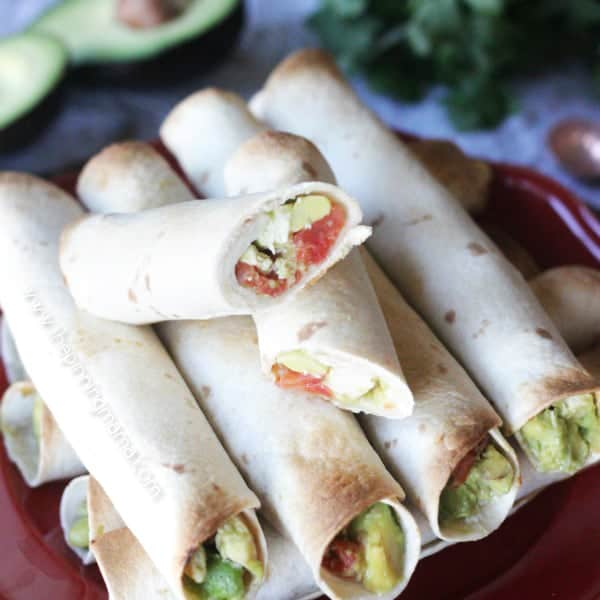 Easy Baked Chicken and Avocado Taquitos - These are the perfect appetizer since you can make a huge batch in the oven pretty quickly. I love any recipe with lots of avocado so these are perfect!