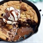 This Peanut butter cup cookie skillet is super easy to make and it is a dessert your whole family will love. Chocolate Chip cookie dough, peanut butter cups, and chocolate chips are melted together in a mini skillet for a dessert made for two.