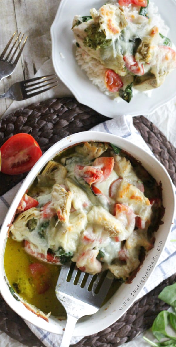 You have to try this AMAZING dinner recipe! Easy Pesto Spinach Artichoke Chicken Bake only takes about 10 minutes to put together and is the BEST dinner!