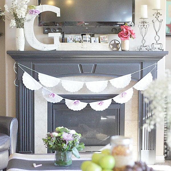 DIY Shabby Chic Doily Banner -Perfect easy DIY decor for vintage or shabby chic themed weddings, bridal shower, baby shower, or birthday party.  The simple white doilies make it perfect to match any colors or theme and it is quick and easy craft idea to make!