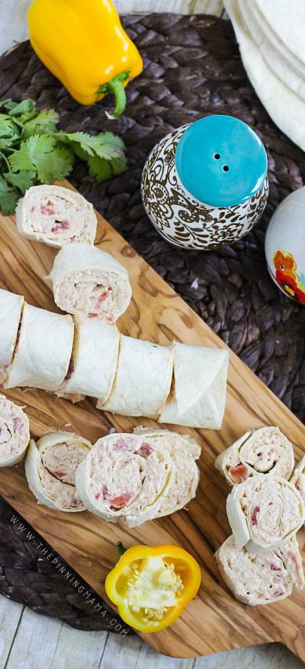 Creamy Taco Roll Ups recipe - This makes a great appetizer idea and is ONLY 5 INGREDIENTS and takes just a few minutes to put together. Perfect for game day, tailgates or even for something fun to put into a lunchbox for school or work.