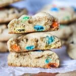 Chewy M&M cookie broken in half so you can see how thick and soft it is