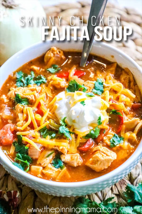Healthy Chicken Fajita Soup topped with sour cream, cilantro and cheese
