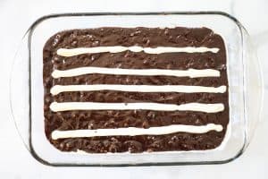 Step 2: Spread lines of cream cheese lengthwise down the brownie pan